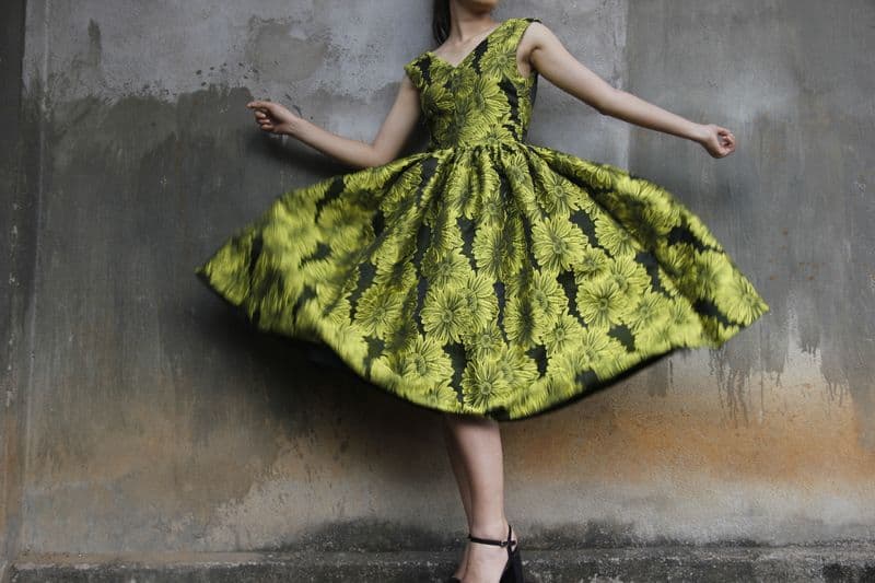 Woman in a flowing green ethnic dress