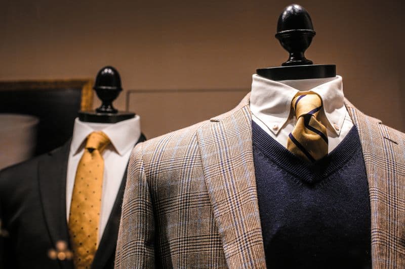 A tailored suit with tie displayed on a mannequin