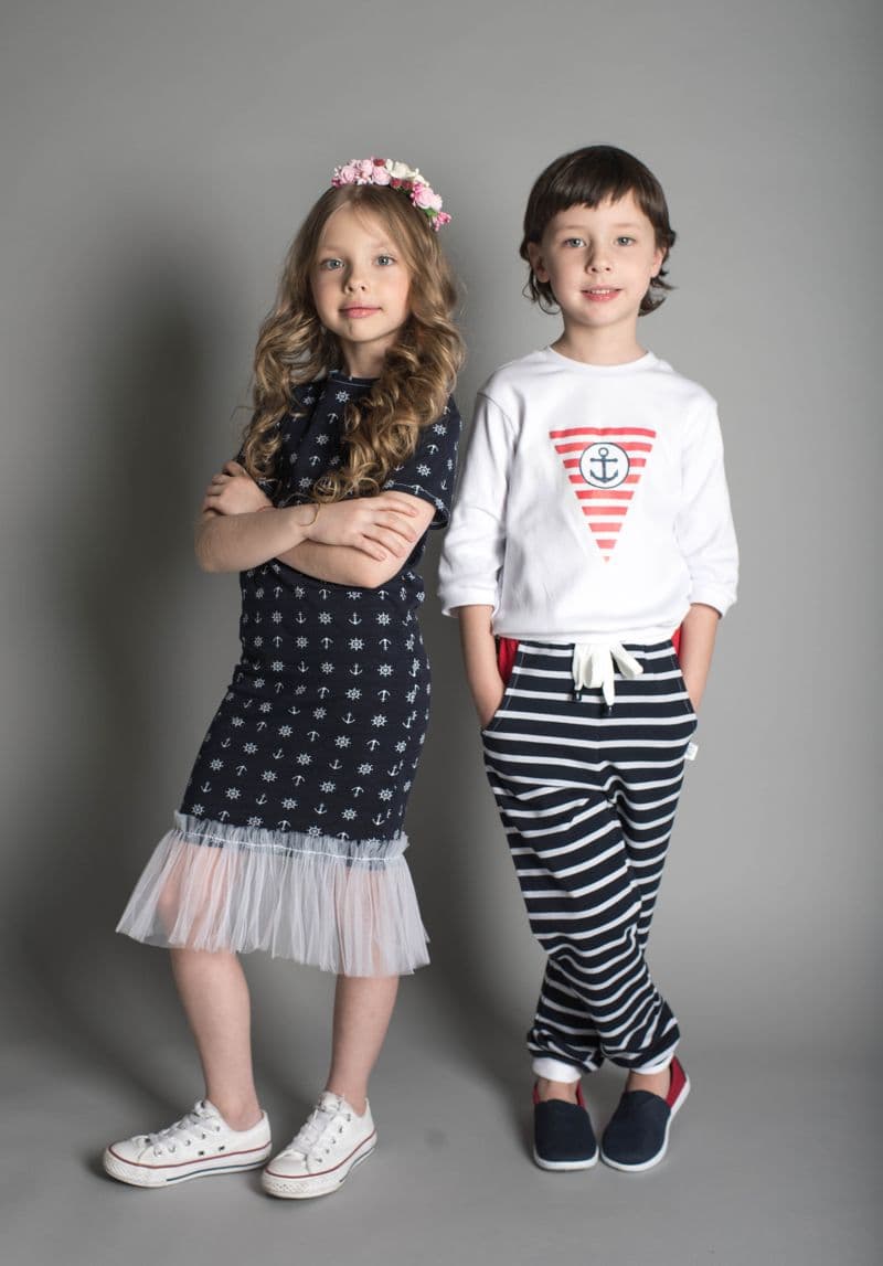 Two children in coordinated stylish outfits