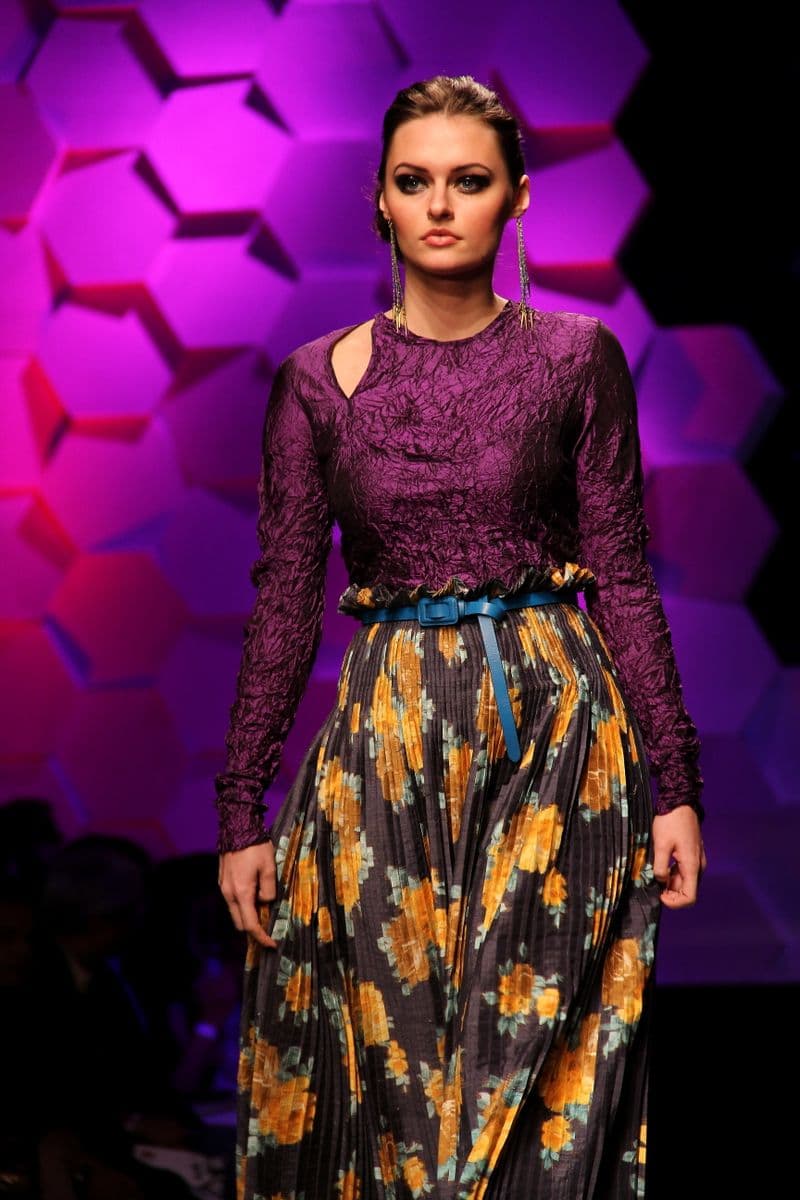 Woman in a richly patterned festive drape