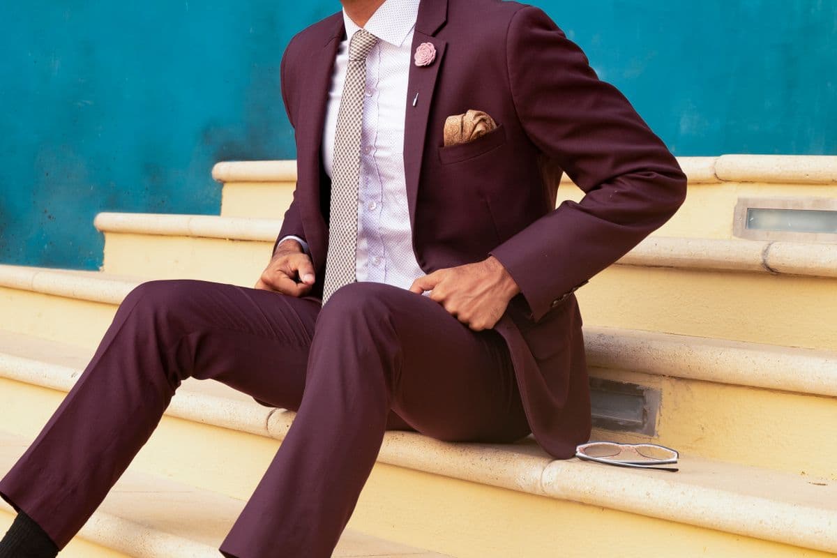 Man in a rich maroon festive suit