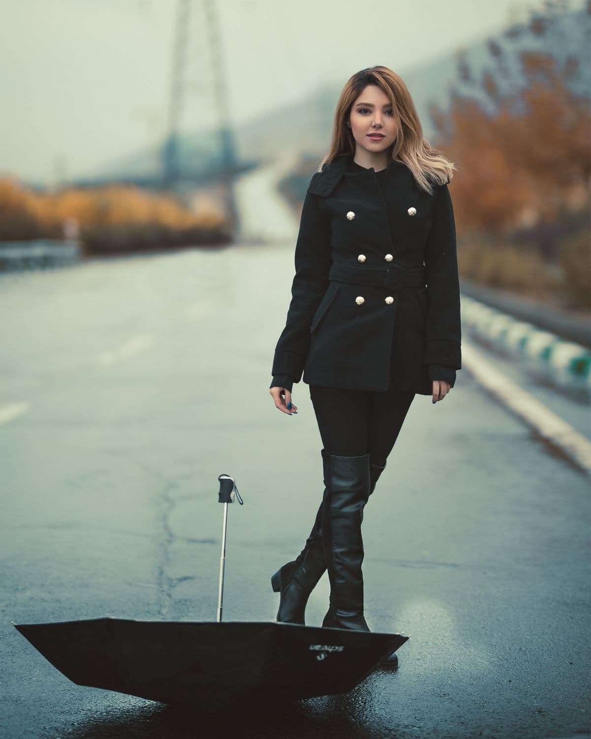 Stylish woman in a tailored coat on a city street